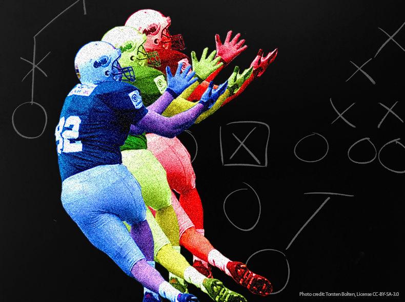 Football player about to catch a ball, with X's and O's diagram in background