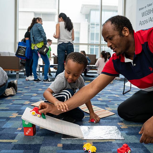 2019 festival attendees playing with toy cars