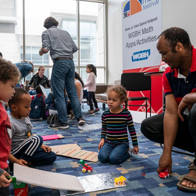 2019 festival attendees playing on the floor