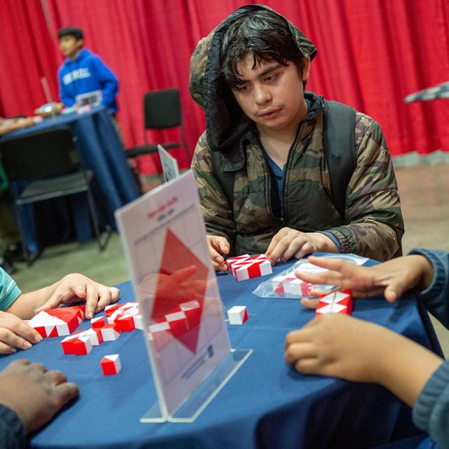 Boy at table with red and white blocks at 2019 festival