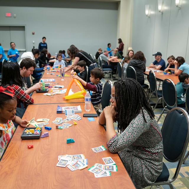 2019 festival attendees at game tables