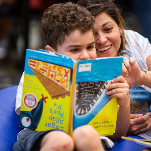 Boy and woman reading book in Mathical reading room at 2019 festival