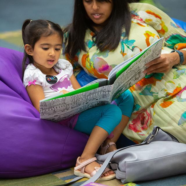 Girl and woman reading book in Mathical reading room at 2019 festival