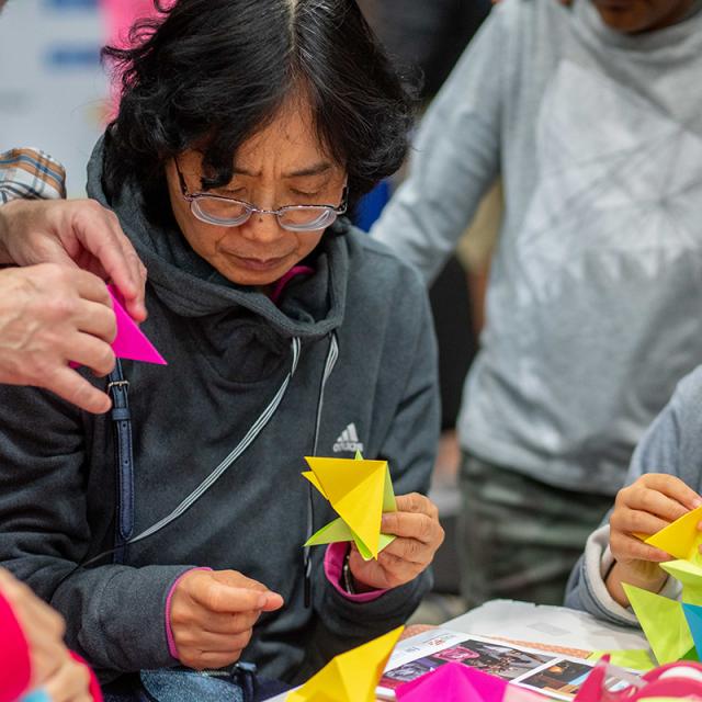 2019 Festival attendees doing origami