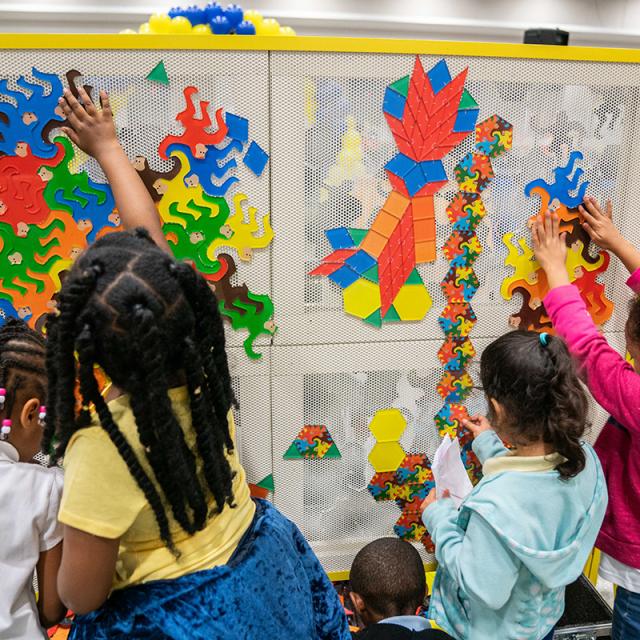 2019 festival attendees playing with colorful pattern blocks